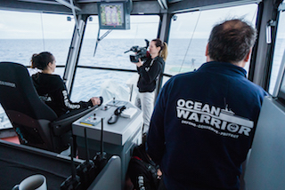 Producer and camera operator Ashleigh Allam films with the DVX200 on the bridge of the M/Y Ocean Warrior off the coast of Antarctica. ©Gavin Garrison/Sea Shepherd Global.