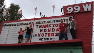 Fans of the 99W in Newberg, Oregon celebrate their win in Honda's Project Drive-In effort.