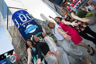 Members of the SMPTE staff celebrate Founder's Day at Nasdaq Market Square in Times Square, New York, from left to right: Aimée Ricca, Roberta Gorman, Mary Vinton, Barbara Lange, Sally-Ann D'Amato, Jewelie Elsbree. Photo by Christopher Galluzzo / Nasdaq, Inc.