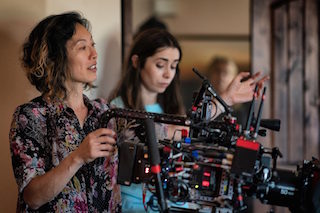 Cinematographer Quyen Tran, left, and actress Cristin Milioti on location for Palm Springs.