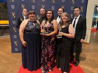At the Heartland Regional Emmy Awards ceremonies, pictured in the front row, left to right, are Danielle Culp, Maggie Cunningham, and Leeann Dreadfulwater. Pictured in the back row, left to right, are Ty Clark, Dustin Howard, Colby Luper, and Tim Rogers.