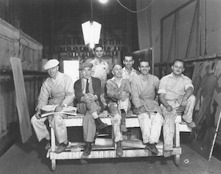 Warner Brothers scenic artists (circa 1930) pictured, left to right, Verne Strang, Bill McConnell, Frankie Cohen, Charley Wallace, Jack Brooks, James McCann, Emmett Alexander (Ed Strang Collection, from the book The Art of the Hollywood Backdrop, by Karen L. Maness and Richard Isackes.