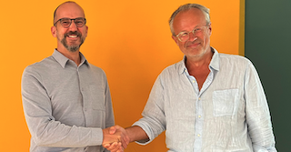 Markus Baumann, sales director dach at Cinionic (left) and Cineplex Geschäftsführer general manager Kim Ludolf Koch.
